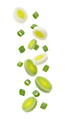 Chopped fresh leeks, sliced, and diced, isolated against a solid black background