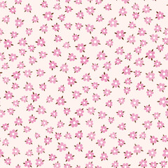 Sweet understated floral background. Seamless pattern of small pink flowers. Lots of tiny pink flowers on delicate pink background. A romantic delicate holiday decor