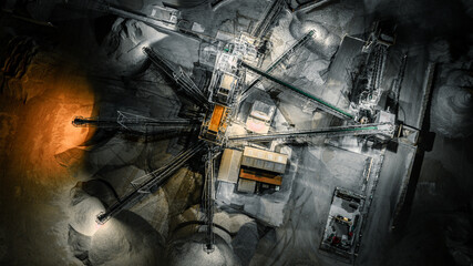 An aerial shot of a quarry plant at night, showing industrial activity and infrastructure. © Pavel Babic