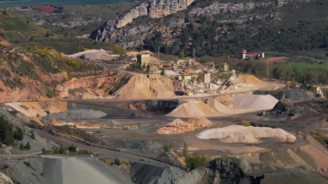 Aerial View of a Large Quarry in a Mountainous Region, Highlighting Industrial Activity and Natural Scenery