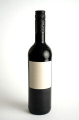 Close-up of a dark glass bottle with condensation droplets, symbolizing freshness, coolness, and refined minimalism in beverage presentation.
