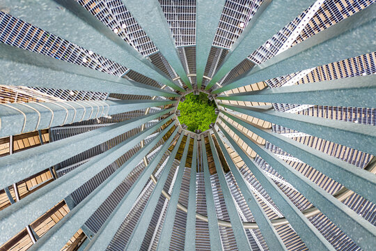 Abstract spiral metal structure with geometric pattern and symmetry, creating a modern industrial background with strong architectural design elements.