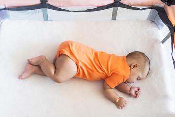 Baby napping alone in crib feeling peaceful