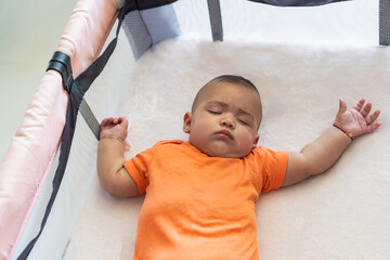 Baby sleeping peacefully in crib concept of rest