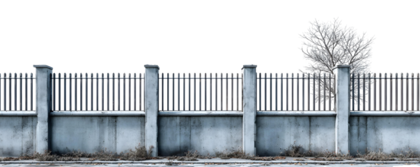 A modern concrete wall topped with a metal fence flanked by stout pillars with a bare tree in the distance against a stark white background
