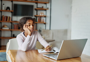Mother and daughter doing homework with laptop fighting and arguing over learning at home....