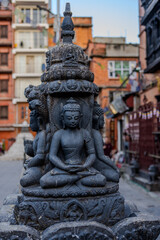 Fototapeta premium Stone Buddha statue at courtyard in Kathmandu