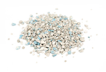 Cat litter filler features a mixture of small granules in light and dark shades, providing effective odor control and comfort for pets in their designated areas