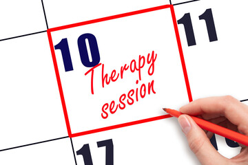 10 th day of the month.  Hand writing Therapy session reminder and drawing red frame on calendar with red pen on white background. concept of health care. Planning and scheduling