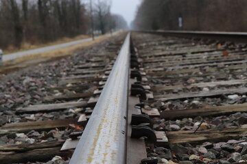 Steel railroad track leading to an endless horizon
