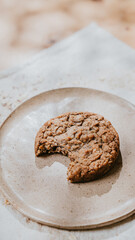 A cookie is on a white plate