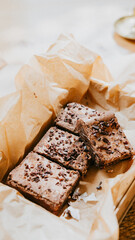 A box of brownies with chocolate chips on top