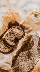A plate of cookies sits on a table next to a candle