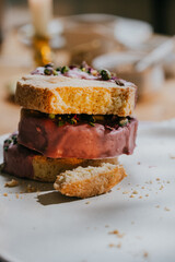 A stack of donuts with a bite taken out of the middle