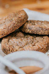 Three cookies stacked on top of each other on a white plate