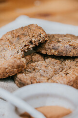 Three cookies are sitting on a white plate