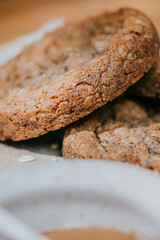 A plate of cookies with a cup of coffee next to it