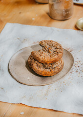 Three cookies stacked on top of each other on a white plate