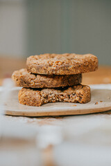 Three cookies stacked on top of each other with one already eaten