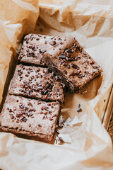 A box of brownies with chocolate chips on top