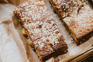 A brown cake with sesame seeds on top