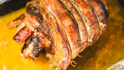 Juicy stuffed beef ribs with calabrese sausage, bacon and vegetables. Golden brown and perfectly cooked, tied with twine. Ideal for gourmet menus and meat promotions.