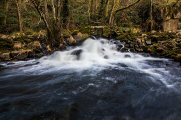 Small stone bridge and water flowing in the Arnoia River