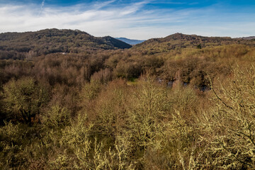Arnoia River Valley covered with a thick autumn forest