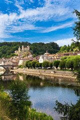 Fototapeta premium Laroquebrou typical village and la Cère river, Cantal, France, is an important passage, the via Arverna, for pilgrims on their way to Santiago de Compostela via Rocamadour.