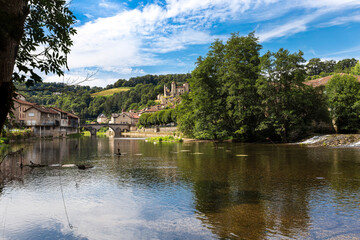Fototapeta premium Laroquebrou typical village and la Cère river, Cantal, France, is an important passage, the via Arverna, for pilgrims on their way to Santiago de Compostela via Rocamadour.