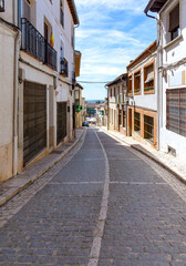 Charming streets of Chinchón, Spain — a historic town of cobblestone alleys, cozy corners, and traditional houses, each graced with its own unique balcony.