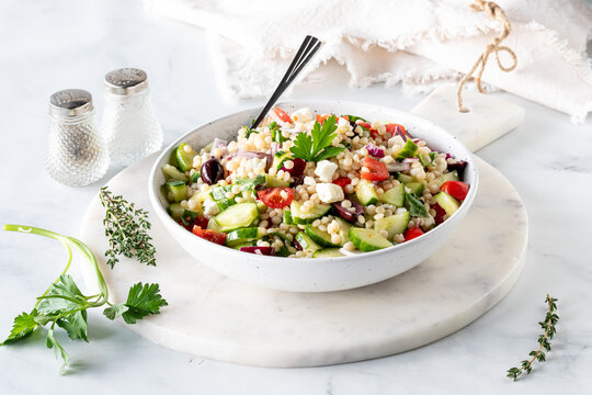 Homemade delicious Mediterranean Israeli couscous salad ready for eating.
