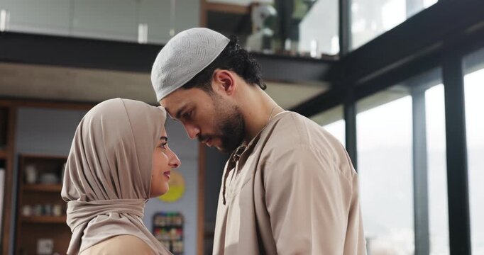 Muslim, couple and forehead kiss in home, religious and bonding on break, trust and people in lounge. Happy, man and relationship with woman in house, love and hijab for Islamic faith or tradition