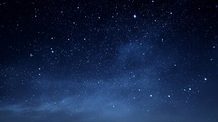 Obraz premium Vast, deep blue night sky shimmering with countless brilliant stars and distant galaxies, inspiring wonder and cosmic exploration.