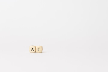 Wooden blocks displaying letters AI on a minimalistic white background, symbolizing artificial intelligence and modern technology concepts. copy space
