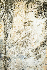 ancient stone wall texture with ancient script and slphabets. texture of ancient Roman archaeological site