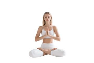 A woman in white sportswear sits in lotus position, meditating with hands in prayer gesture, promoting relaxation and mindfulness.