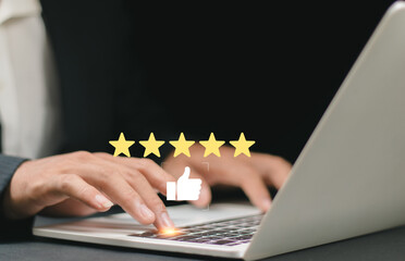 Review and satisfaction concept, Customer giving five star rating and positive feedback on laptop, online reputation management for business and digital marketing performance.