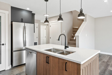 Kitchen with a stainless steel sink and a silver dishwasher