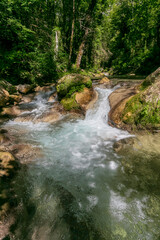 Small waterfalls of the Gervanne river near the waterfall of the Druise, Vercors, Drome, France.