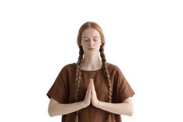 Young woman with braided hair in meditation pose, eyes closed, practicing mindfulness and relaxation.