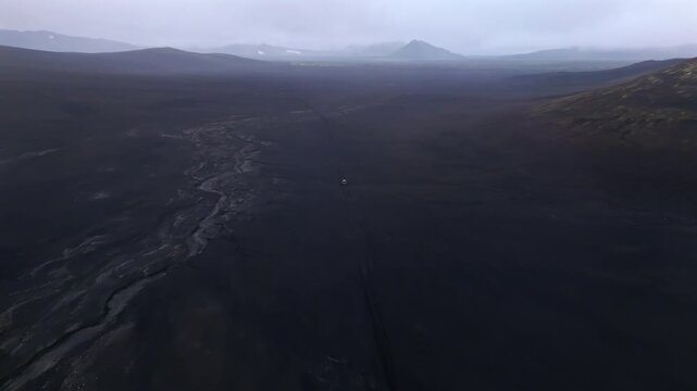 Buggy Driving on Volcanic Black Desert in Iceland Aerial View