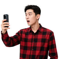 A man wearing a red and black checkered shirt is taking a selfie with his smartphone, showing a surprised expression.