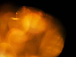 Colorful light leaks on black background for design and special effects. Retro film look. Abstract colorful light beams.