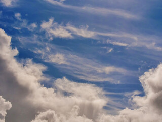 Obraz premium Fluffy cloudy sky. Nature background for design and sky replacement.