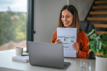 Woman presenting financial data during remote video call