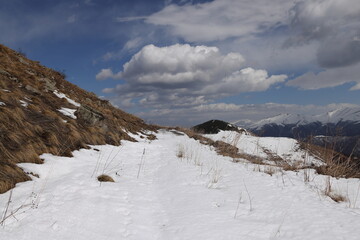 Snowy trail on mountain slope under blue sky, Lori, Armenia