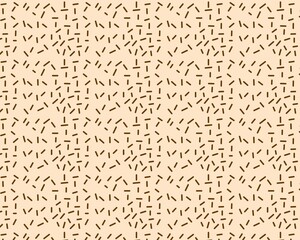 Seamless chocolate sprinkles illustration. Irregular chocolate sprinkles for the background. Chocolate-themed food concept illustration.