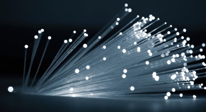 Glowing optical fibers radiating light points, representing digital data transmission