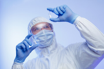 Scientist making quality control of glass slide ampoule in pharmaceutical laboratory. Development...